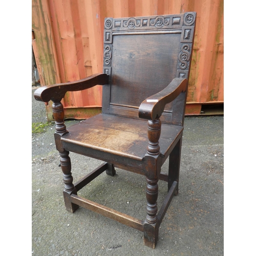 1023 - A stunning antique English oak Wainscot chair, with simple carved design.