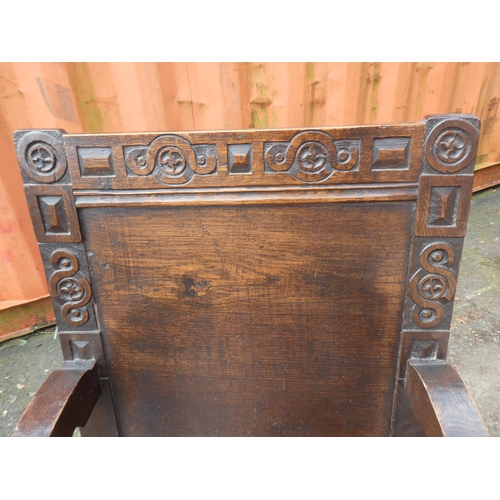 1023 - A stunning antique English oak Wainscot chair, with simple carved design.