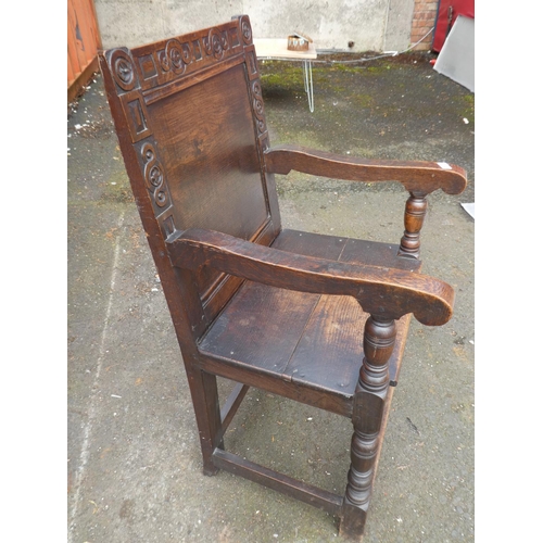 1023 - A stunning antique English oak Wainscot chair, with simple carved design.