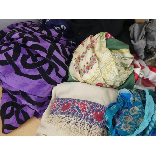 1034 - An assortment of various silk scarves etc.