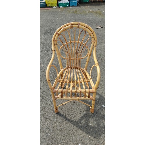 597 - A vintage wicker and cane chair.