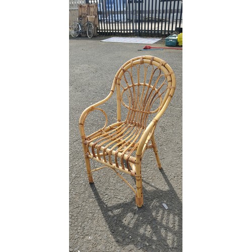 597 - A vintage wicker and cane chair.