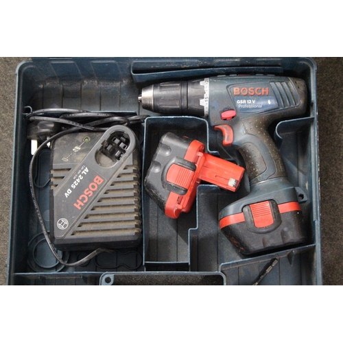 11 - A Bosch cordless drill in case.