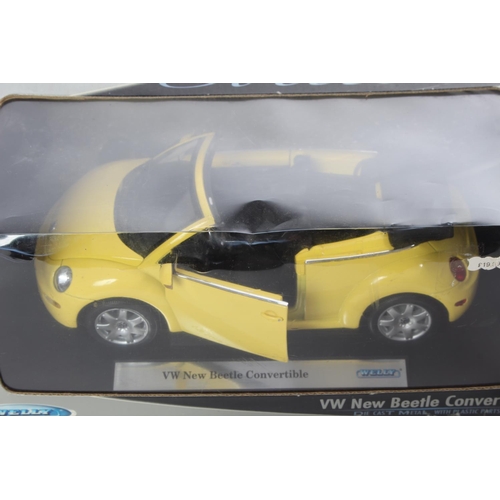 2 - A boxed VW New Beetle Convertible model car, by Welly.