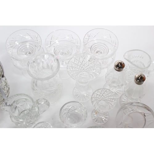 23 - A large assortment of crystal etc to include Waterford & more.