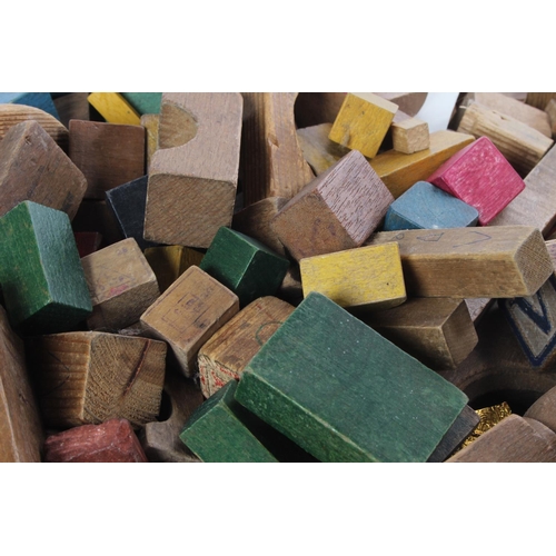 29 - A large assortment of vintage wooden building blocks.