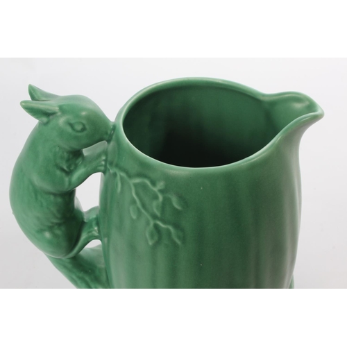 37 - A large green Sylvac water jug, with squirrel handle.