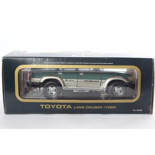 4 - A boxed Toyota Land Cruiser (1992) model car, by Road Tough.