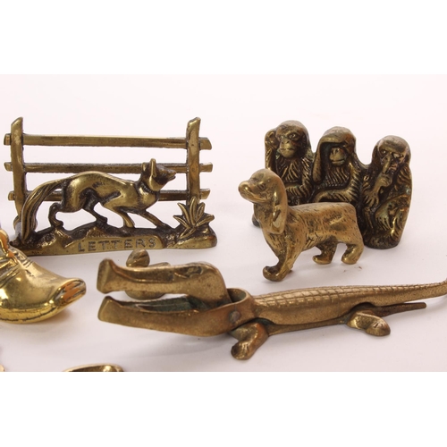 41 - An assortment of brassware, to include crocodile & more.