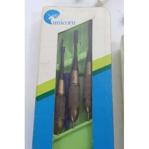 45 - A vintage cased set of Unicorn darts and more.