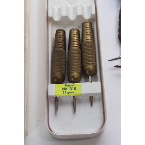 45 - A vintage cased set of Unicorn darts and more.