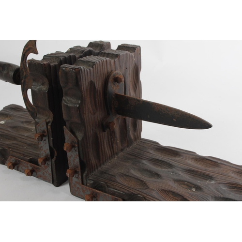 54 - An unusual pair of wooden bookends in the style of a dagger.