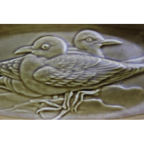 55 - A vintage Poole pottery dish decorated with birds.