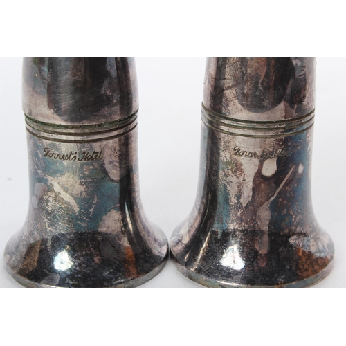 60 - A pair of silver plated 'Forrest's Hotel' salt and pepper shakers.