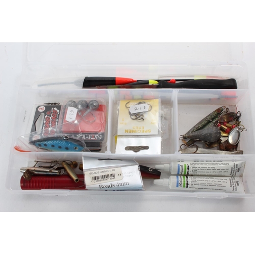 129 - A fishing storage case and lures etc.