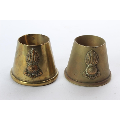 132 - A pair of vintage military crested brass holders.
