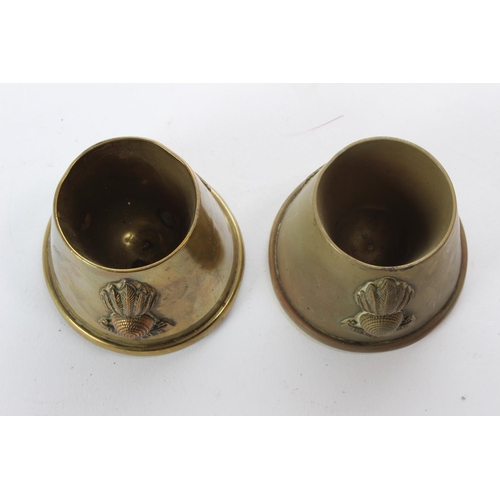 132 - A pair of vintage military crested brass holders.
