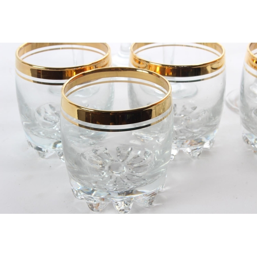 133 - Two sets of six gilted glass sets.