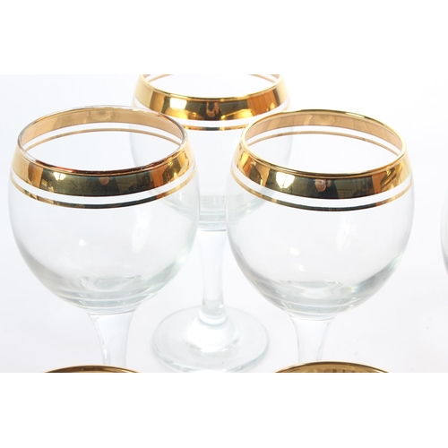 133 - Two sets of six gilted glass sets.