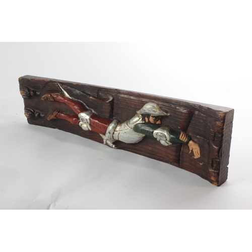 140 - A wooden wall plaque.