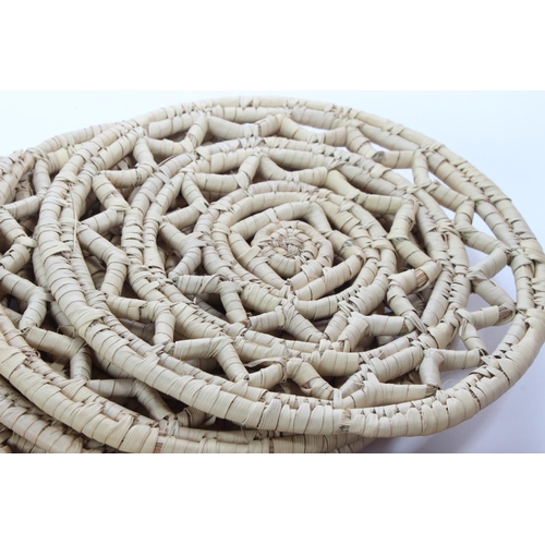 156 - A collection of rattan placemats.
