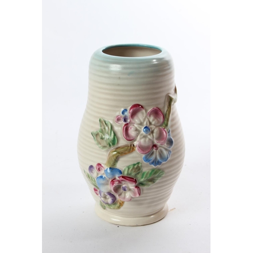 164 - A stunning Clarice Cliff Newport Pottery vase decorated with flowers.
