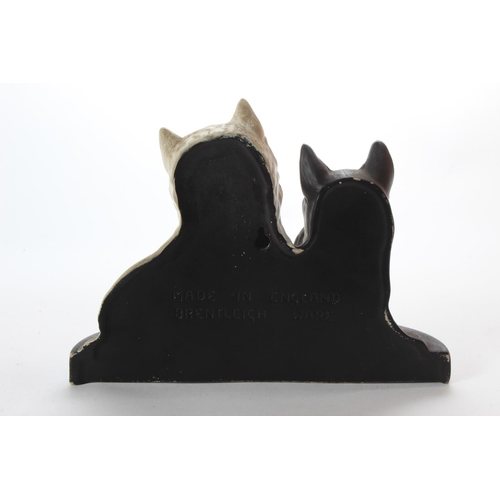 197 - A stunning antique ceramic pub advertising figure for Black & White Scotch Whiskey, produced by Bren... 