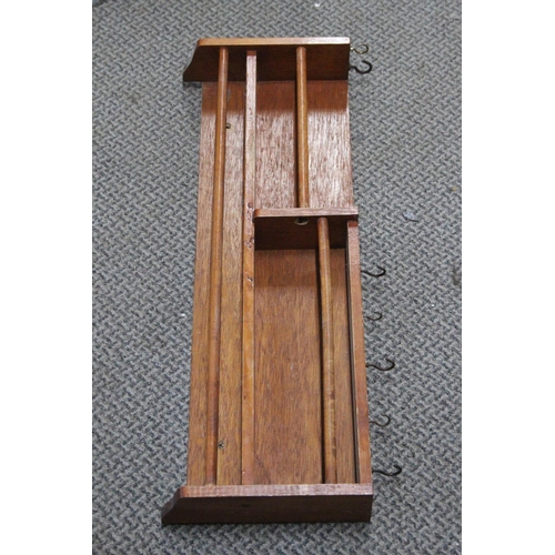 236 - A wooden wall rack with five cup hooks.