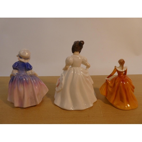 102 - Three Royal Doulton figures 'Fragrance HN3220, Dinky Do HN1678, and Amanda HN3635'.