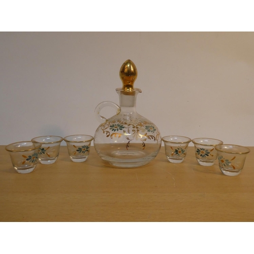 109 - A vintage hand painted decanter and six shot glass set.