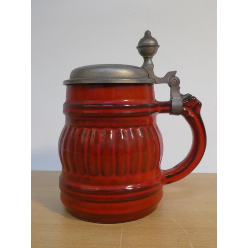 110 - A stoneware lidded tankard.