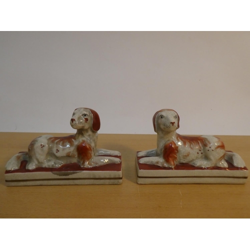 114 - A pair of antique style Staffordshire dogs.