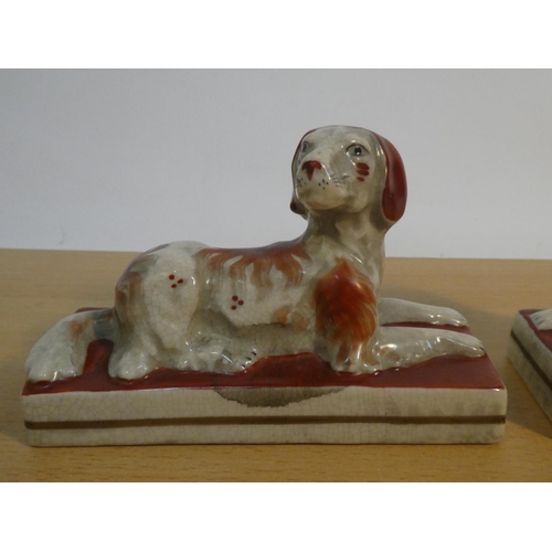 114 - A pair of antique style Staffordshire dogs.