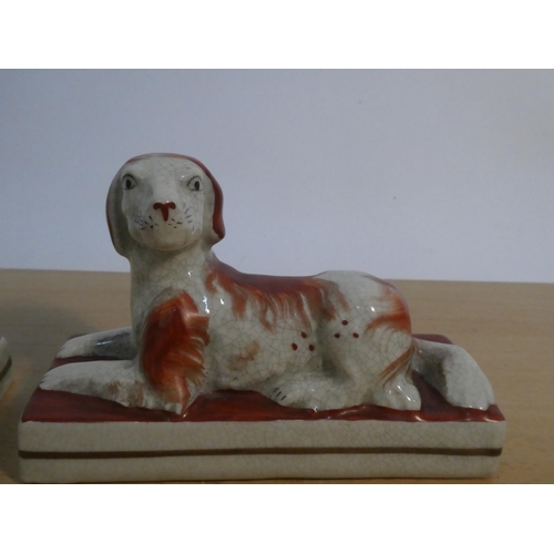 114 - A pair of antique style Staffordshire dogs.