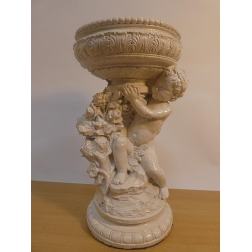 123 - A concrete cherub design pedestal, 40cm tall.