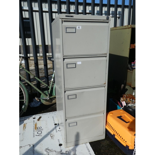 62 - A four drawer metal filing cabinet.