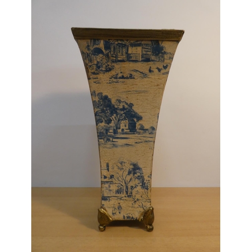 65 - A blue and white patterned metal vase.