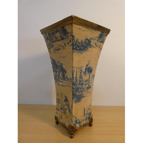 65 - A blue and white patterned metal vase.