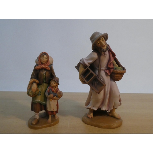 72 - Two wood carving figures, one signed Moroder 25/02/2000.