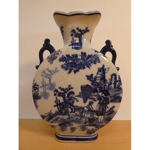 74 - A blue and white patterned ceramic vase.