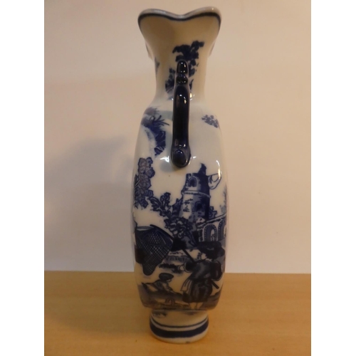 74 - A blue and white patterned ceramic vase.