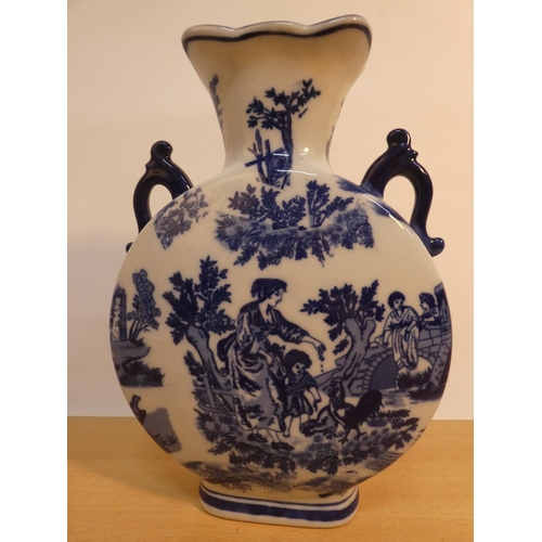 74 - A blue and white patterned ceramic vase.