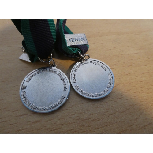 78 - Two Royal Irish Parade 2015 medal.