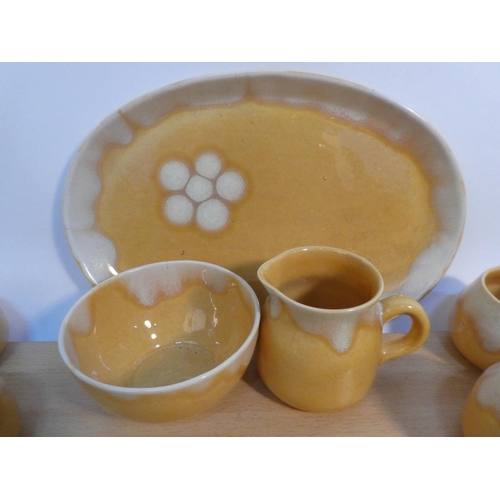 79 - A set of six Portrush Pottery coffee cups, milk jug and sugar bowl and matching platter.