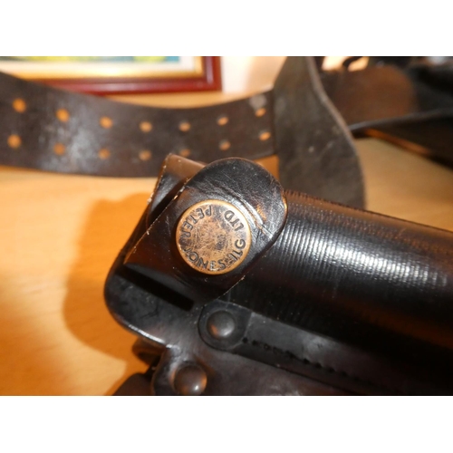 643 - An RUC 9215 C/5 leather holster and an Ulster Special Constabulary Association framed picture.