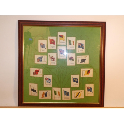 651 - A framed display of 20 antique Cigarette silk flags.