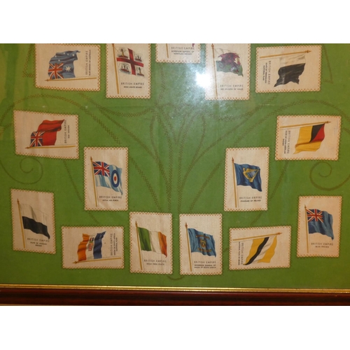 651 - A framed display of 20 antique Cigarette silk flags.