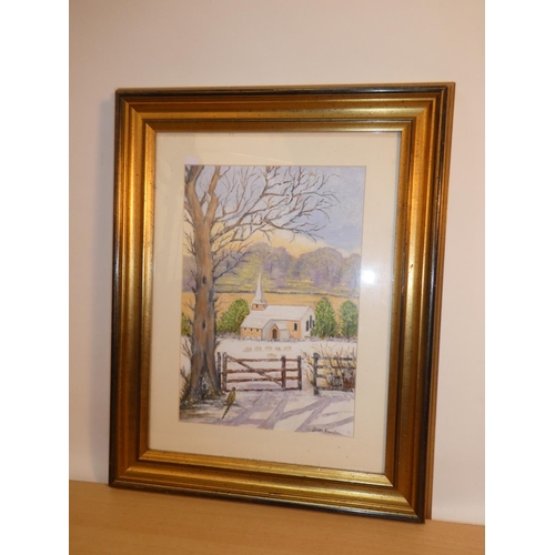 664 - A gilt framed watercolour of a winter scene signed Jean Proctor.