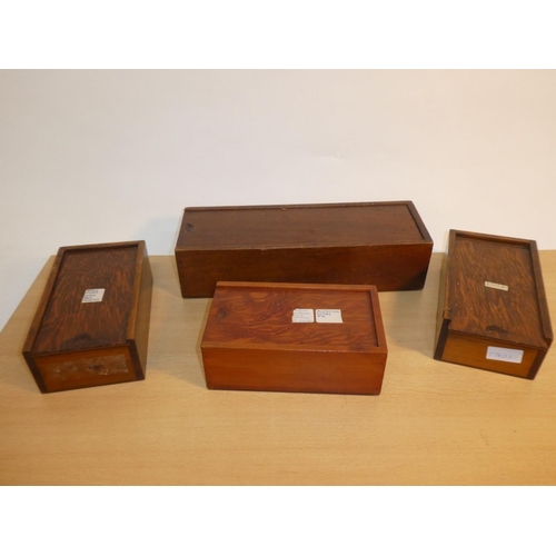 666 - Four handmade wooden storage boxes.