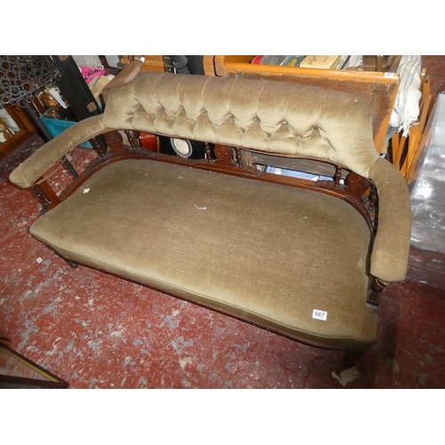 667 - An antique mahogany sofa/window seat with deep buttoned back panel